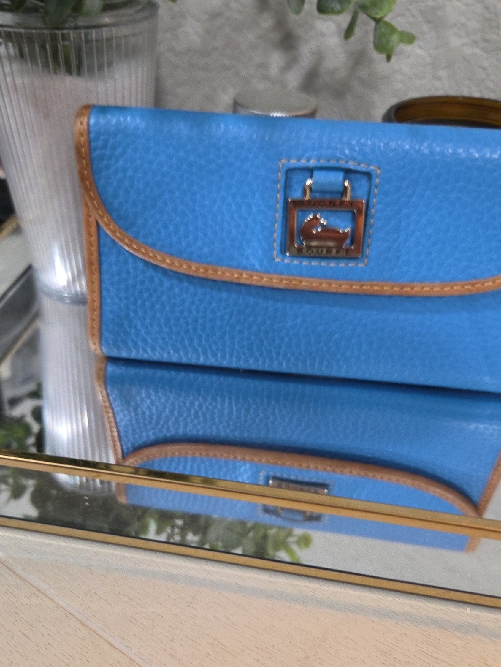 Dooney & Bourke Bright Blue Pebbled Leather Clutch with Brown Trim